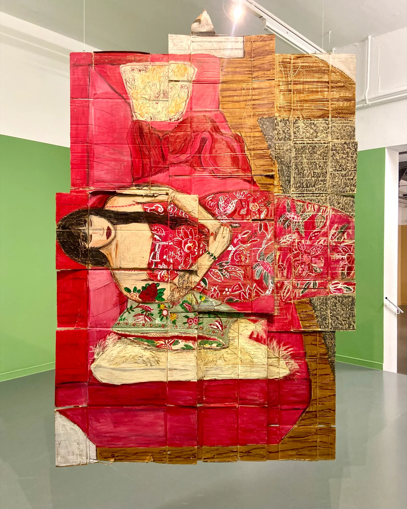 Large collage portrait in red modelled by Xiang, by Pris Roos, exhibited at Kunsthal Rotterdam