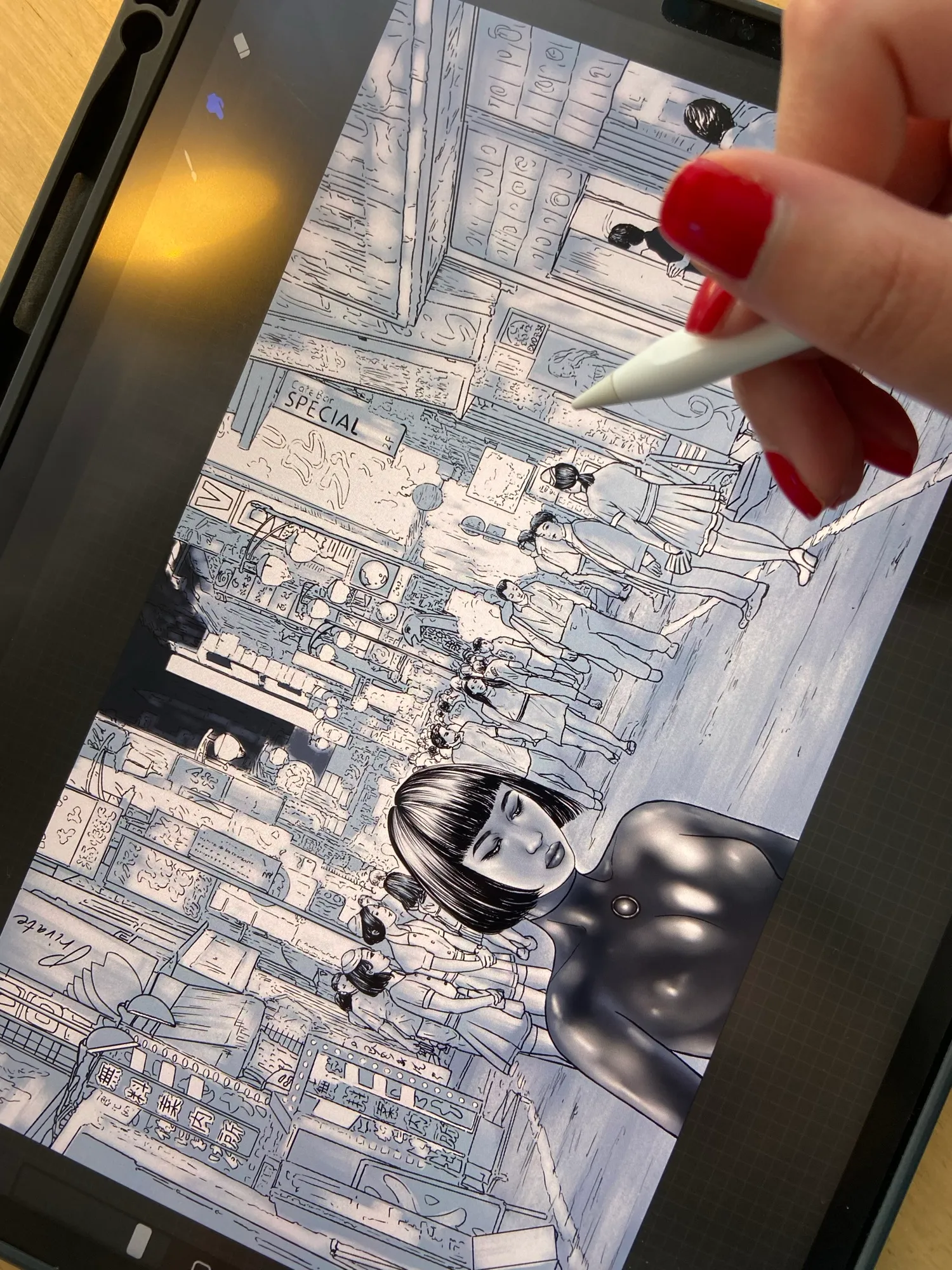 The Shinjuku street scene mid-inking on the iPad, pencil in hand
