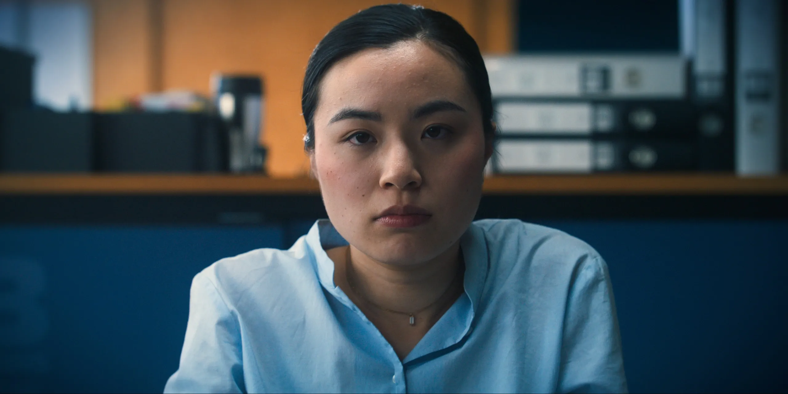 Ami at her desk in the shipping office