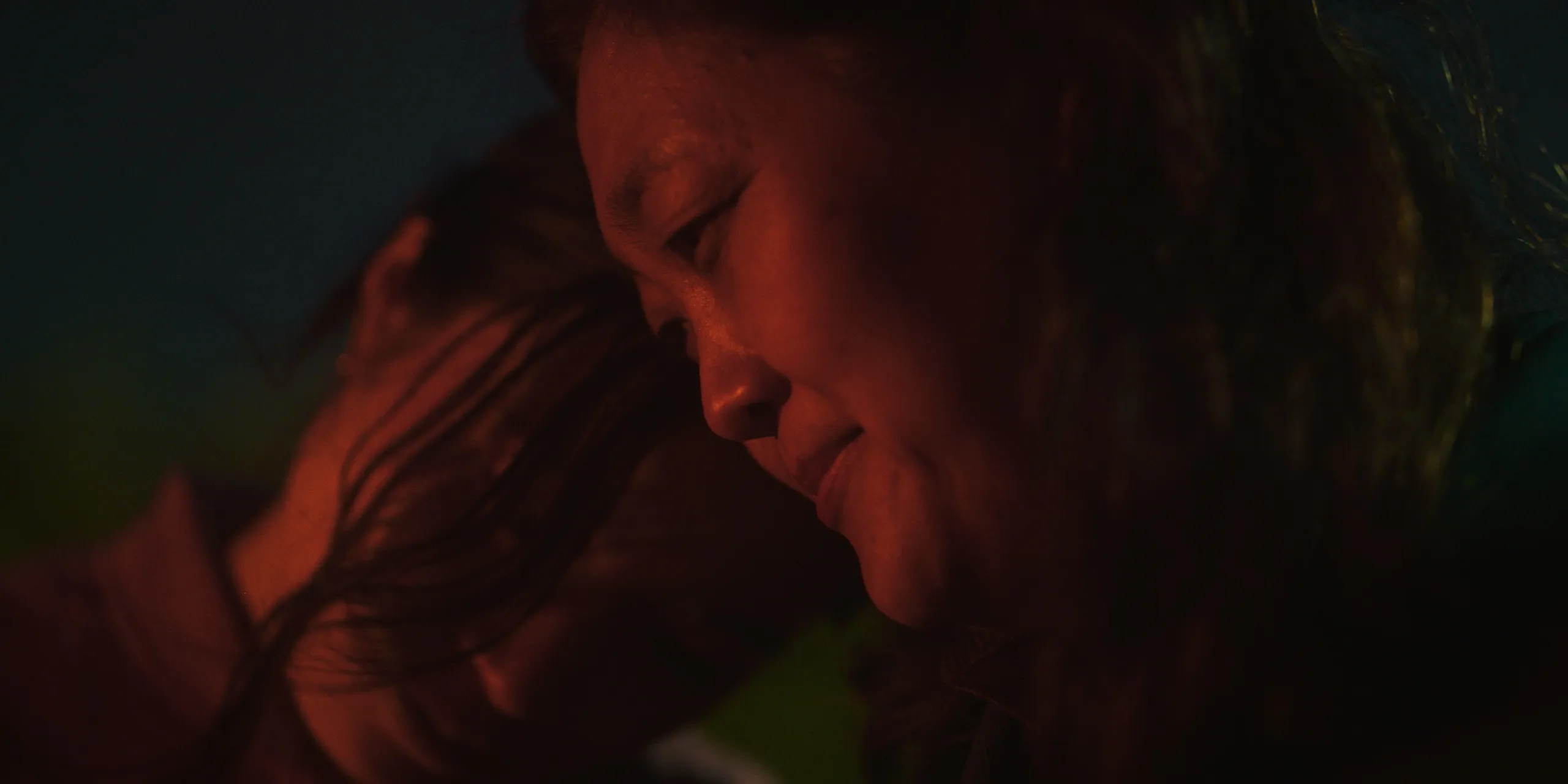 Ami and her mother close together in warm evening light